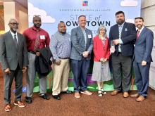 GoTriangle staff and board members are recognized with Downtown Raleigh Alliance's Bill King with the Imprint Award