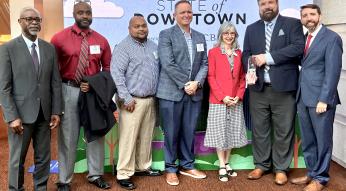 GoTriangle staff and board members are recognized with Downtown Raleigh Alliance's Bill King with the Imprint Award