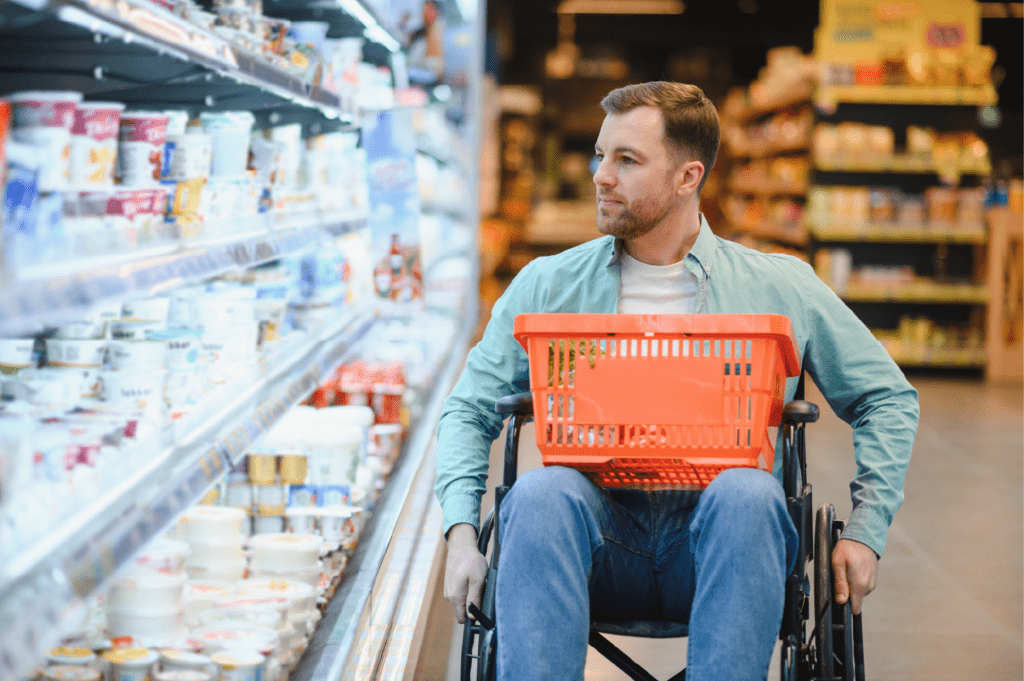 man in a wheelchair shopping